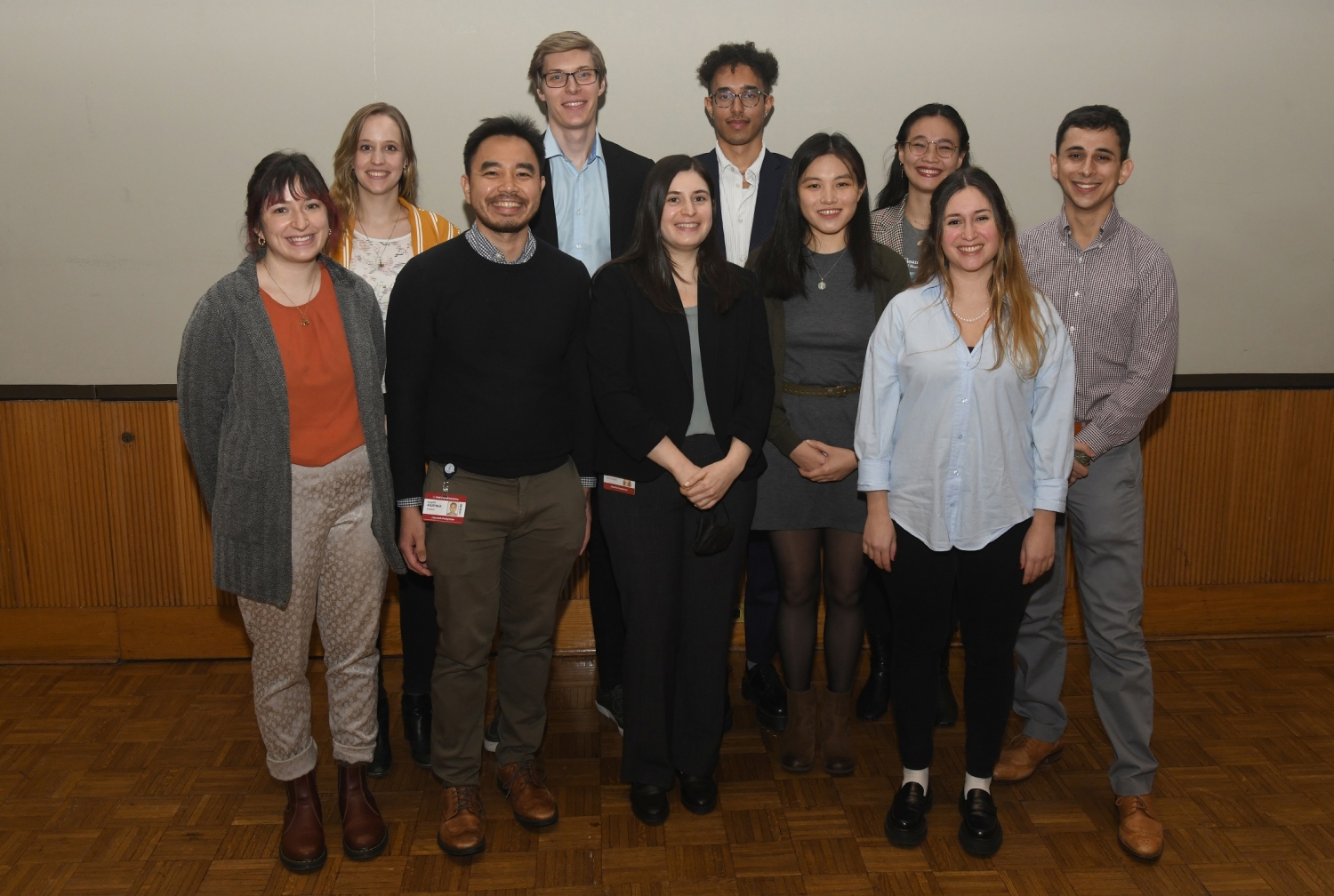 Ten doctoral candidates pose in during the Three Minute Thesis event.