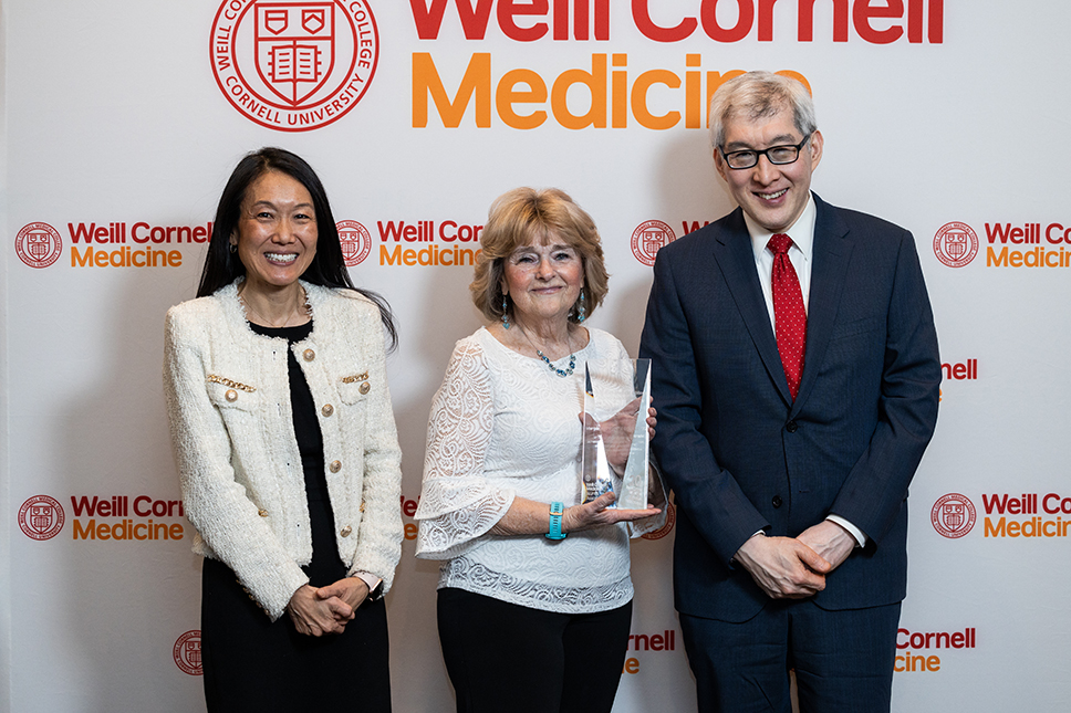 Drs. Yoon Kang, Margaret Bia and Francis Lee posing in front of a Weill Cornell Medicine branded backdrop.