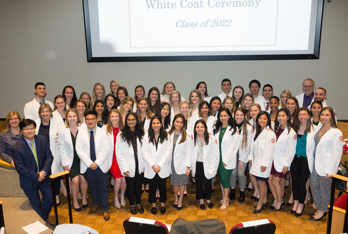 The PA Class of 2022 poses in their new white coats