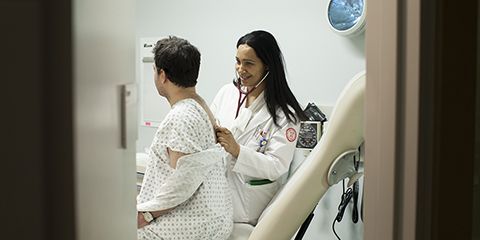 Doctor treating a patient.