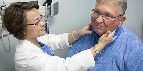 Doctor performing checkup on patient